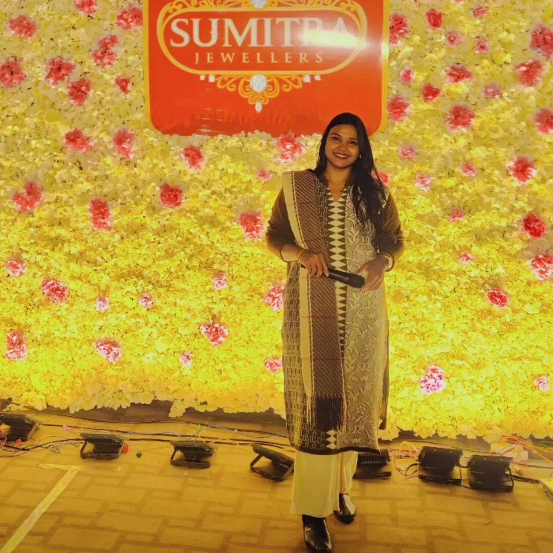On stage with the mic for Sumitra Jewellers